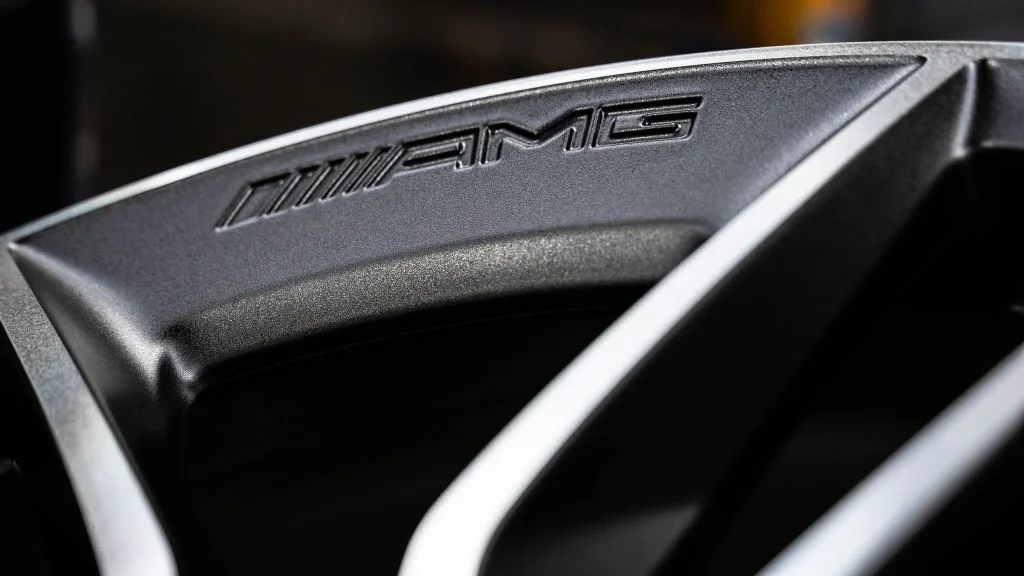 Close-up of a diamond-cut AMG wheel spoke and its machined edge