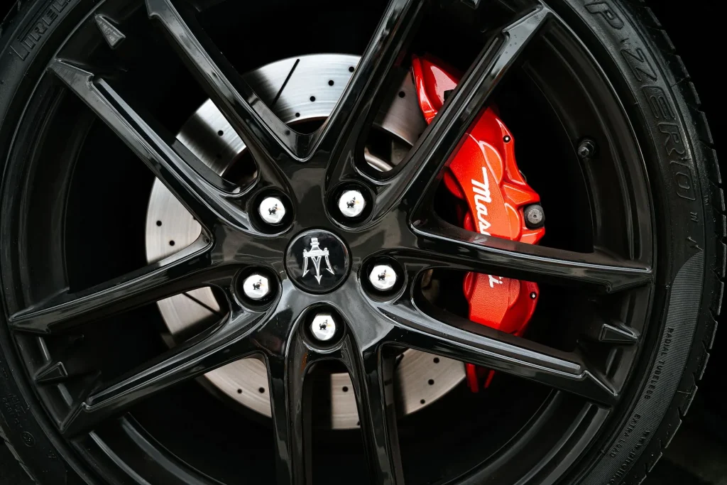 Alloy wheel with a red brake calliper behind it
