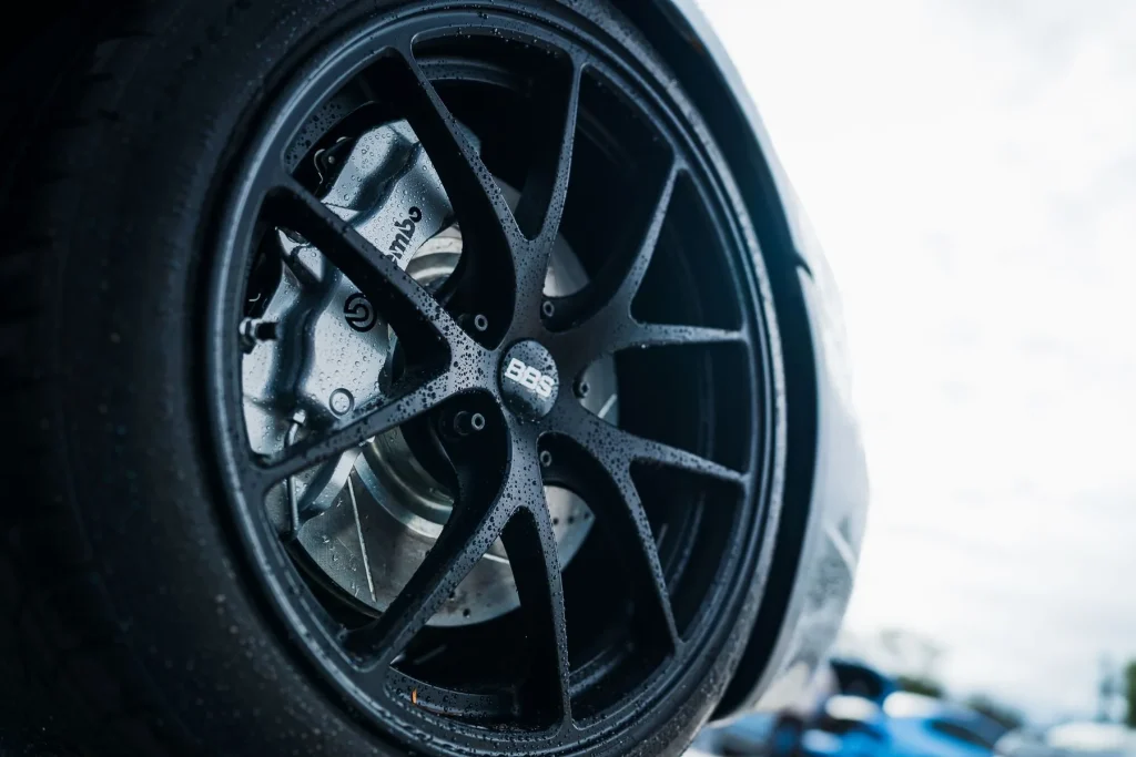 Multi-spoke alloy wheel over a large brake calliper