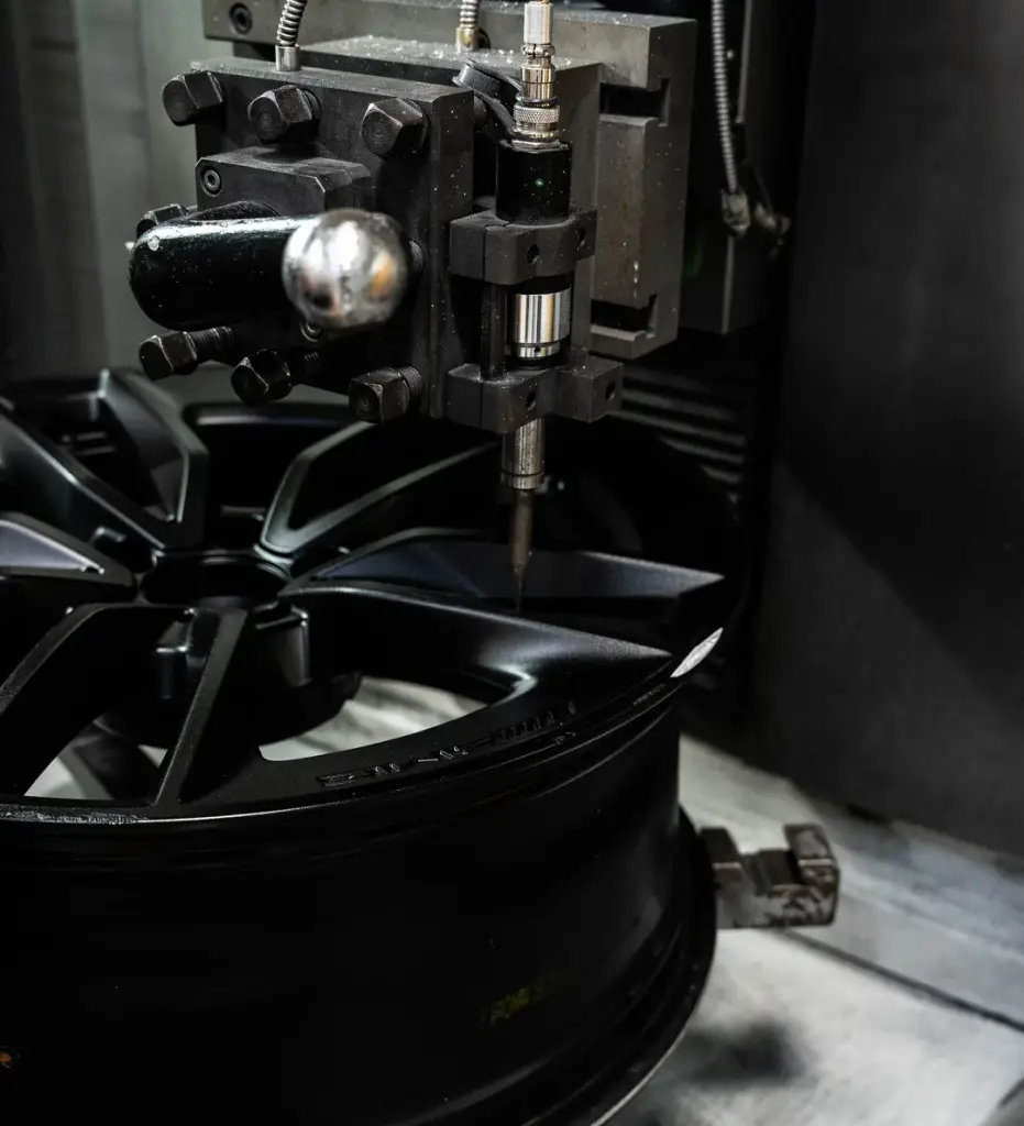 An alloy wheel being diamond cut on the lathe